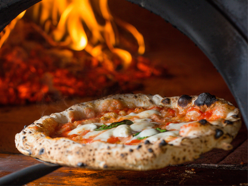 Wood-Fired Pizza Margherita in an Outdoor Pizza Oven
