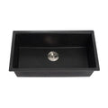 Black kitchen sink with silver drain on a white background
