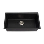 Black kitchen sink with silver drain on a white background