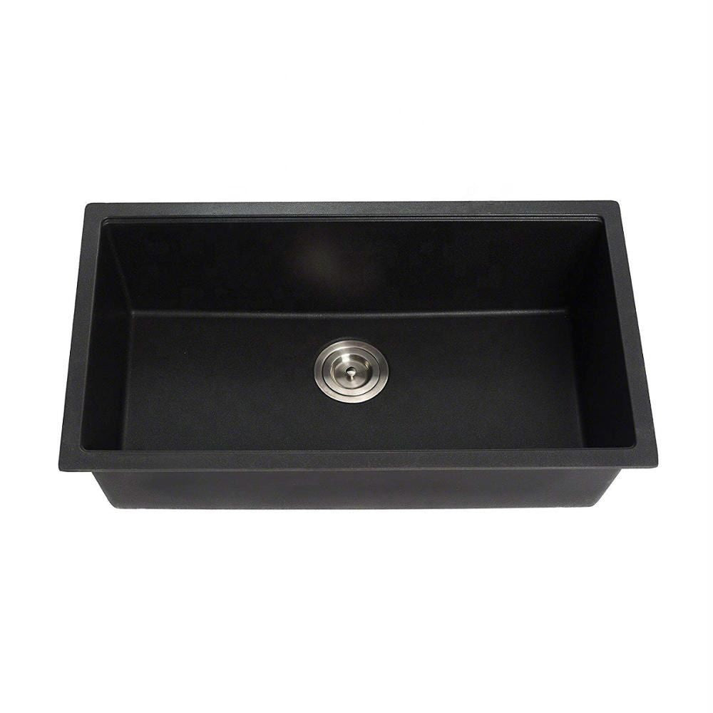 Black kitchen sink with silver drain on a white background